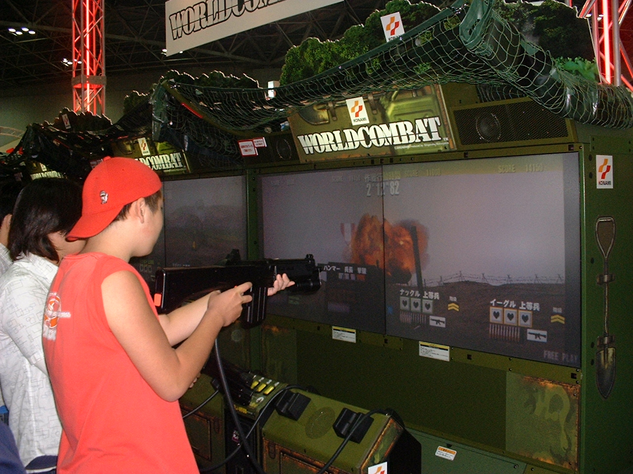 several people play the world combat light gun game