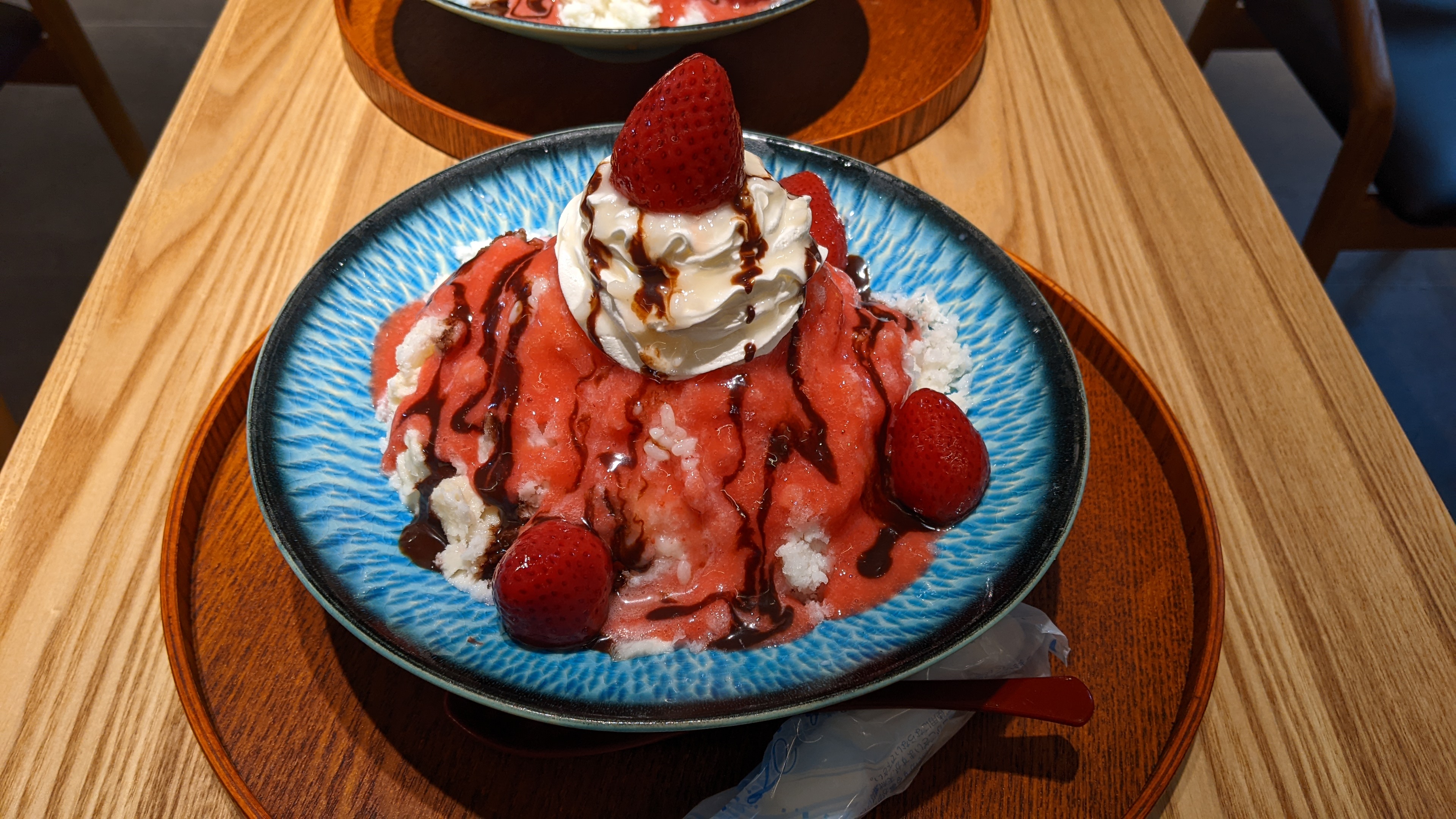 shaved ice with strawberries and sauce