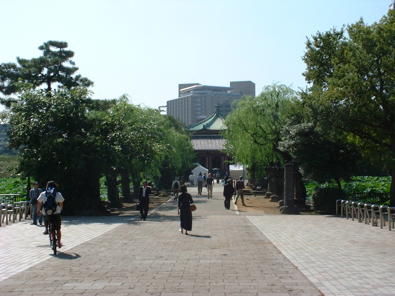 a park walkway toward a shrine