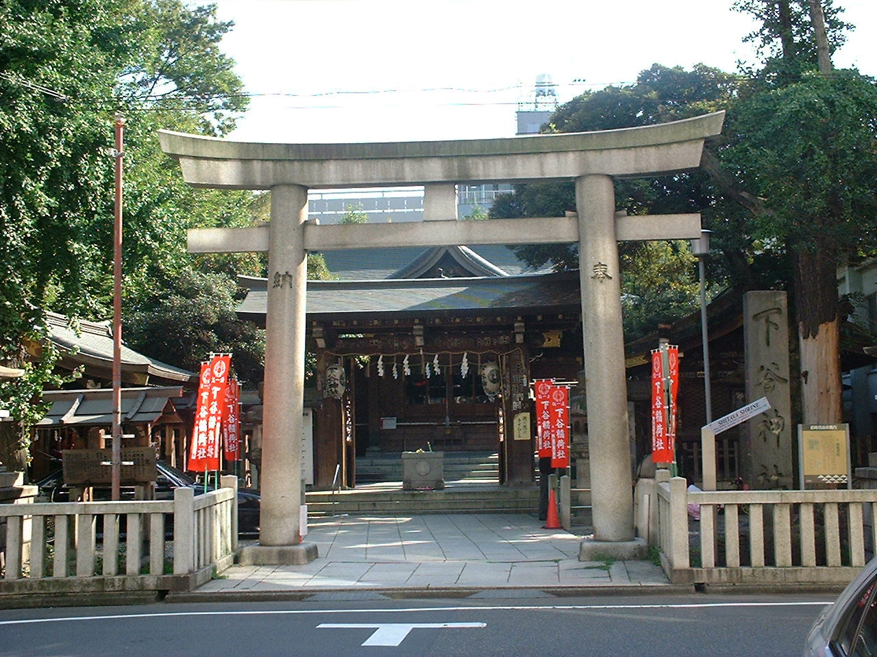 a stone torii gate at the entrance to a shrine