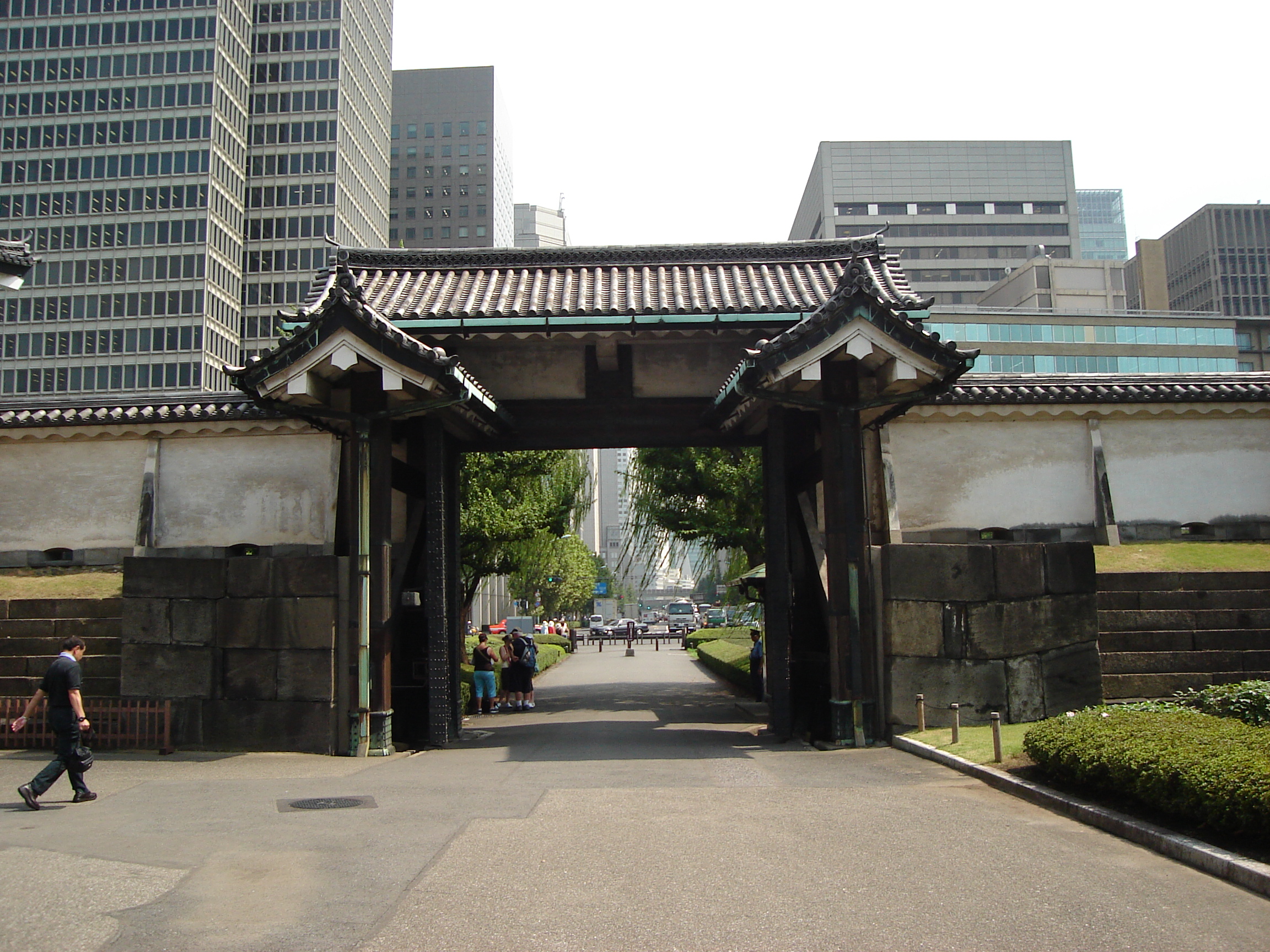 a view through the entry gate to the city buildings outside