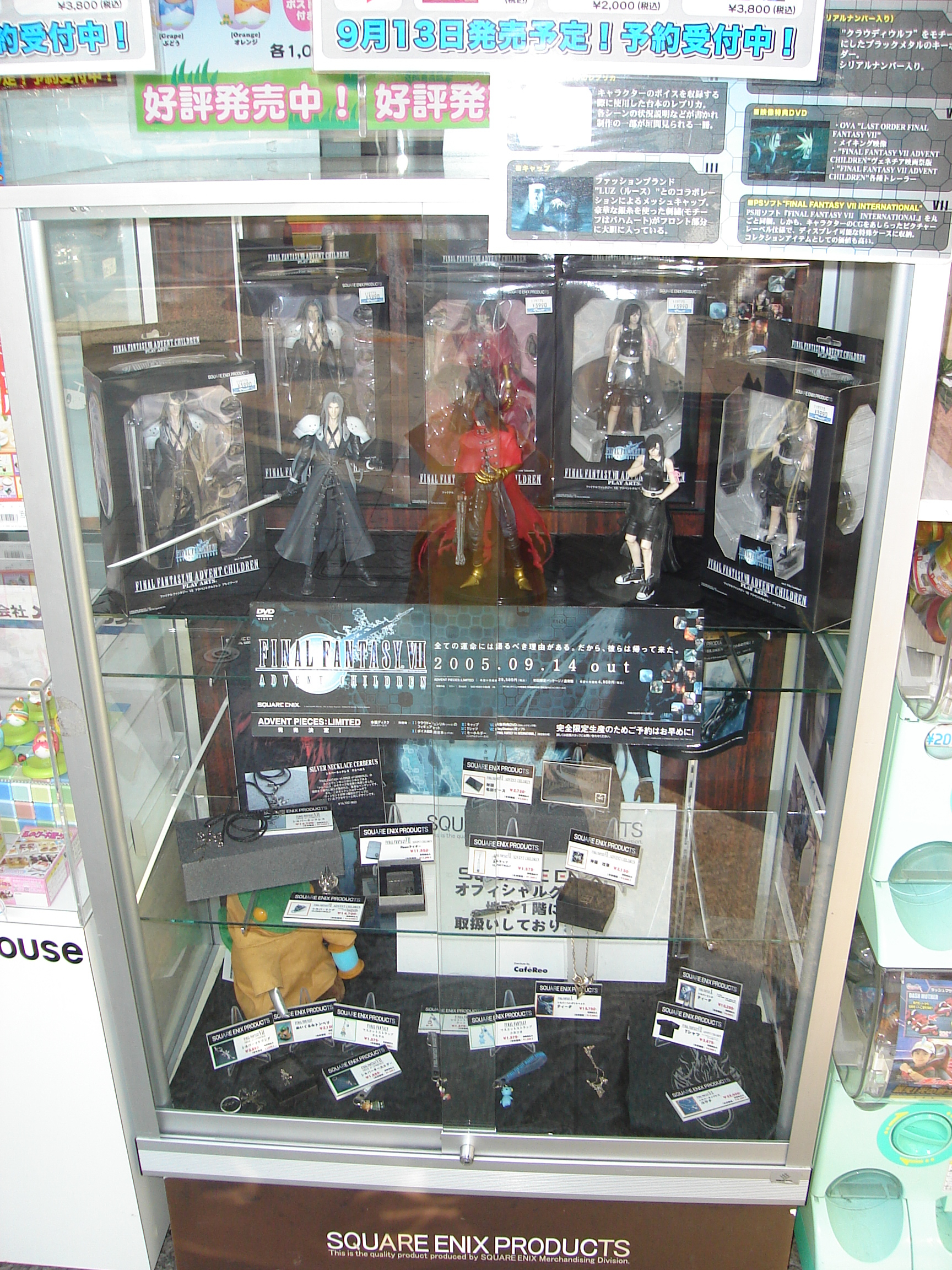 a glass case filled with assorted final fantasy figures and items
