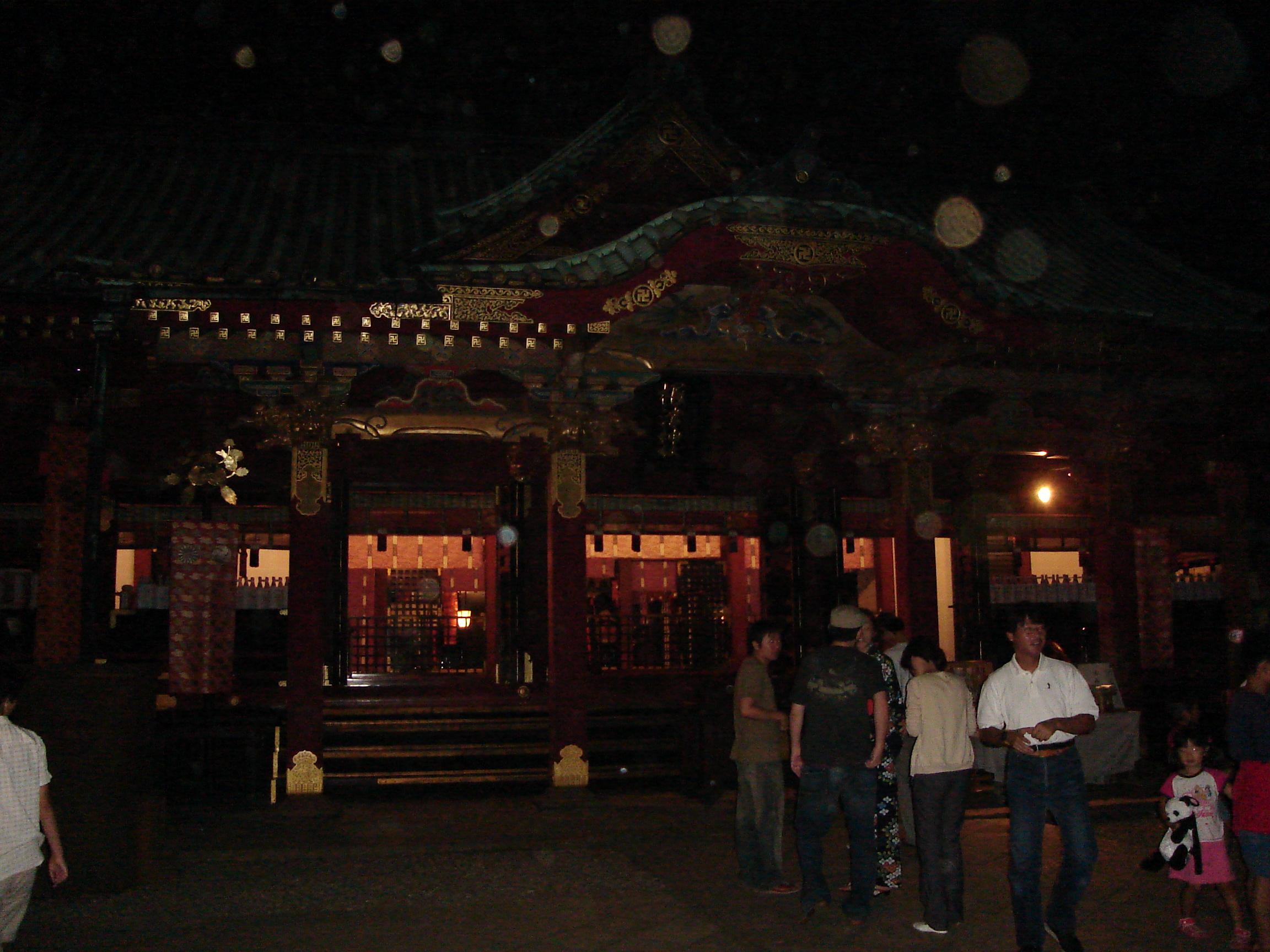 nezu shrine with a line of people outside