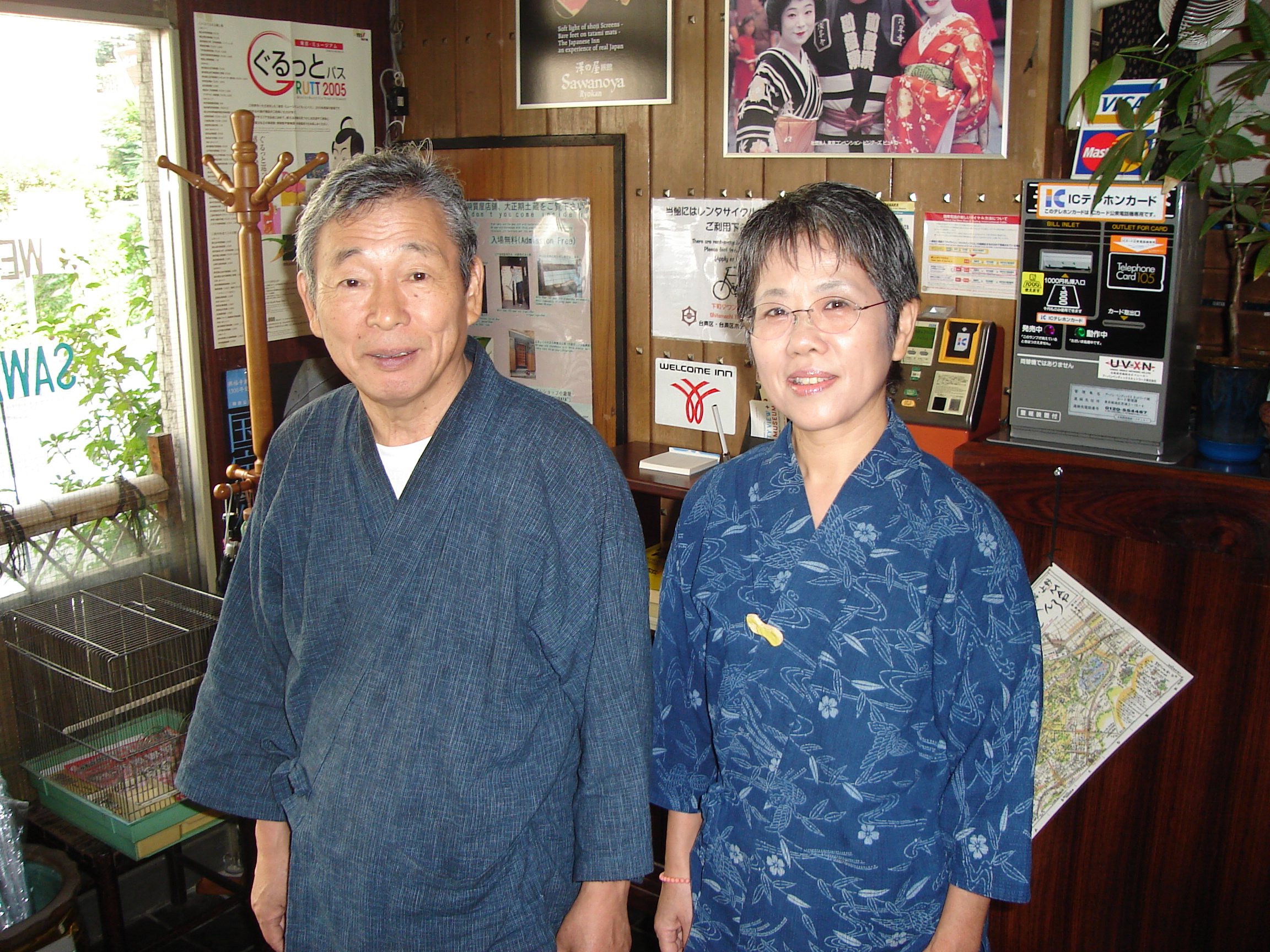 middle aged japanese couple wearing traditional house clothes