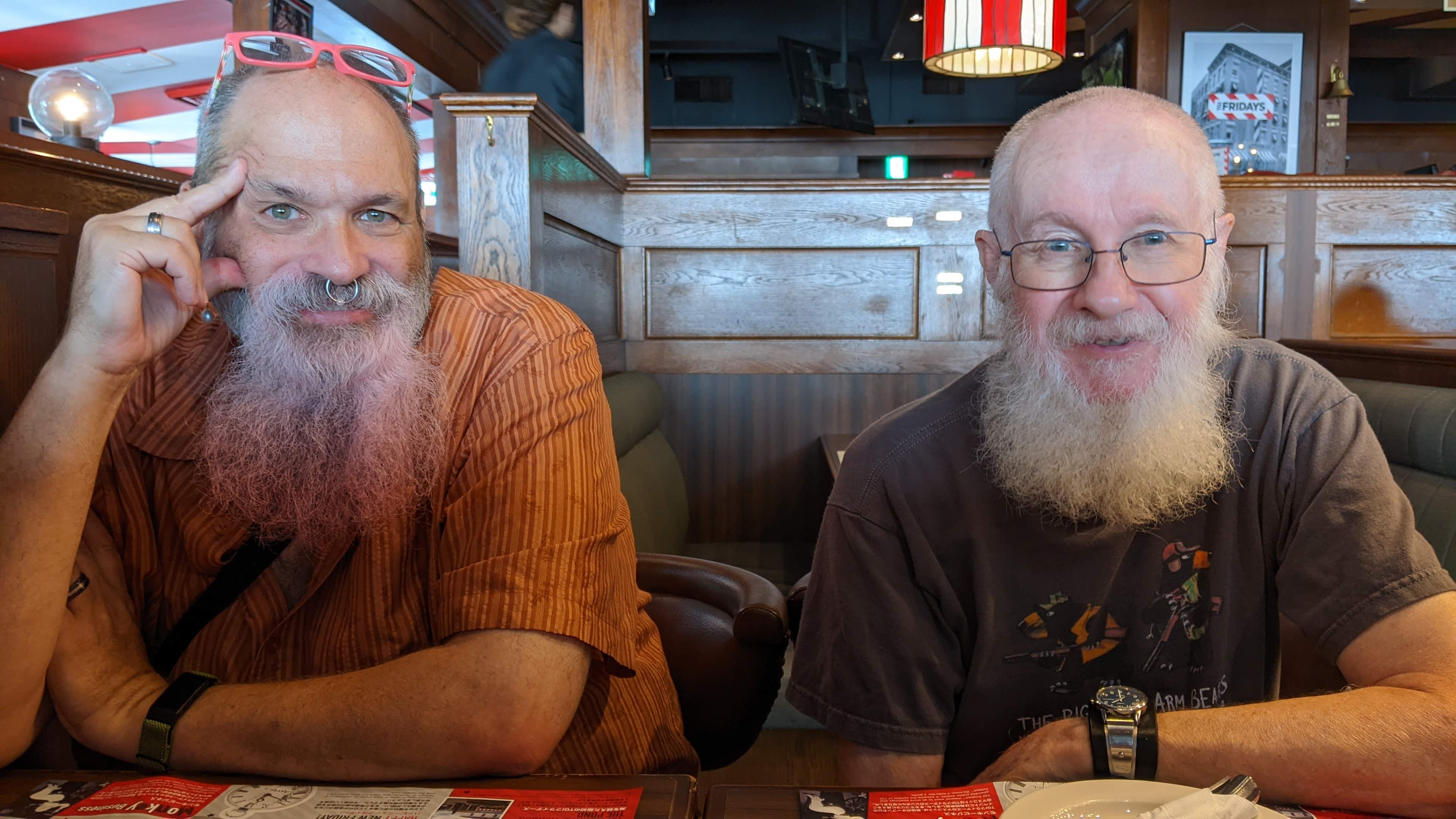 Les with a pink beard and Chris with a white beard