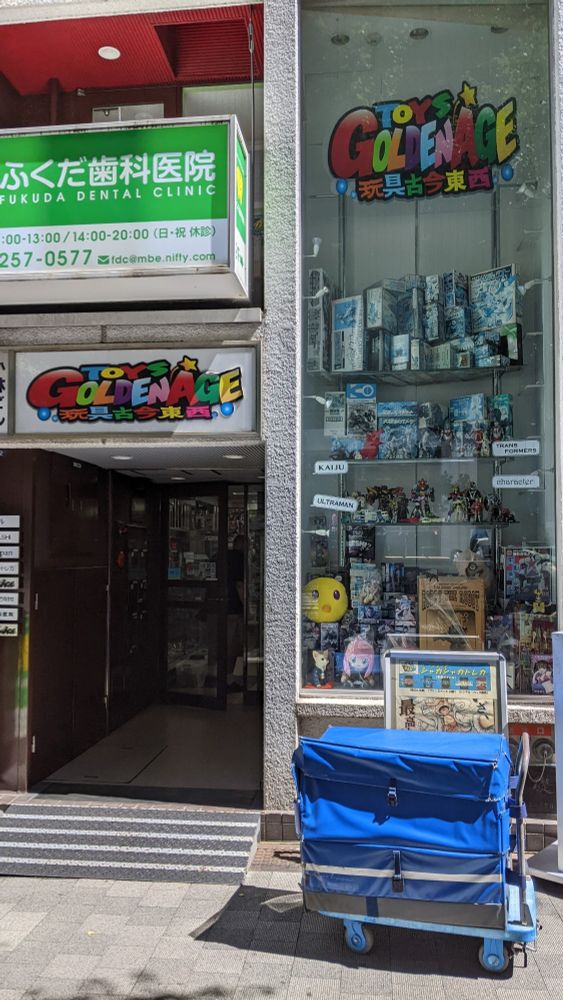 A store called Toys Goldenage with boxes and figures in the window