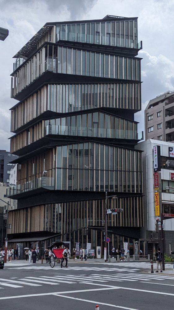 A building where each floor looks partially rotated like a Rubik's cube