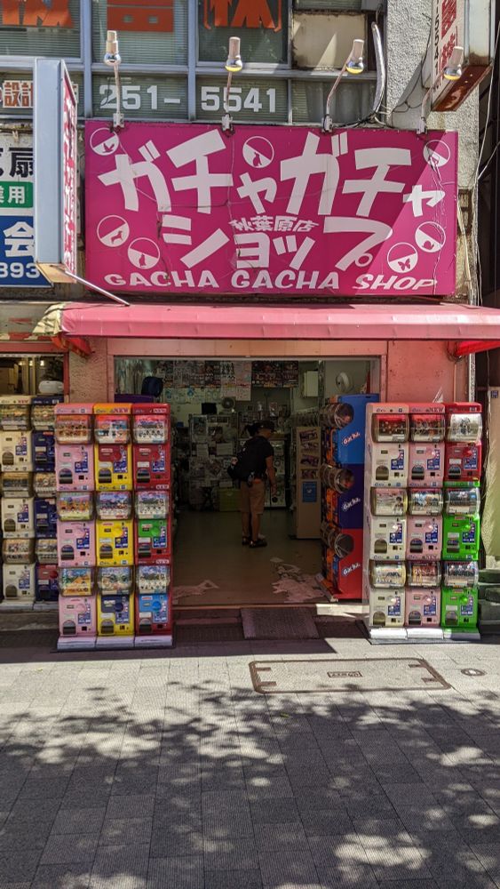 Gacha Gacha Shop with some gacha machines outside